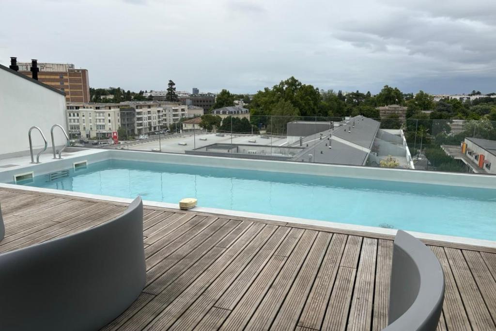 a large swimming pool on top of a building at Spacious apartment in Talence in Talence