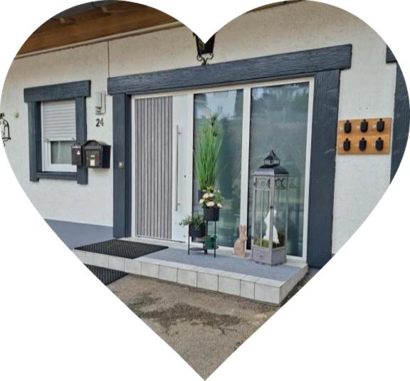 a heart shaped picture of a house with a window at Haus Anna in Bodenmais