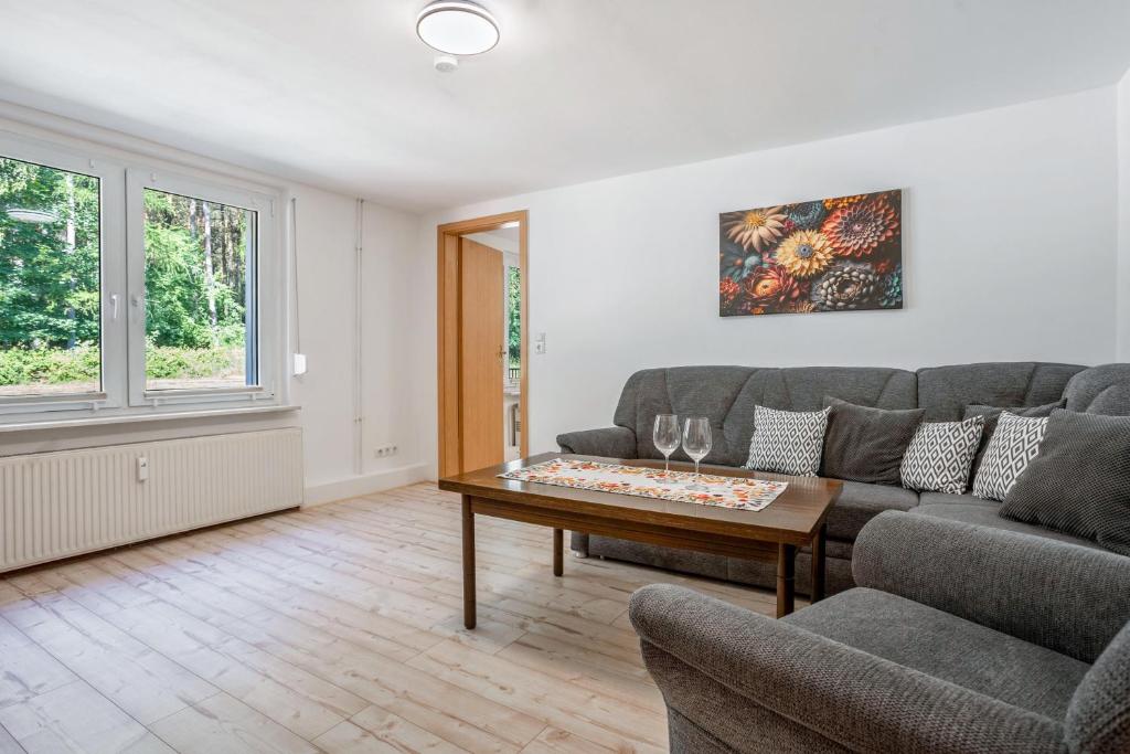 a living room with a couch and a table at Ferienwohnung bis zu 6 Per. 65 M² in Wolgast