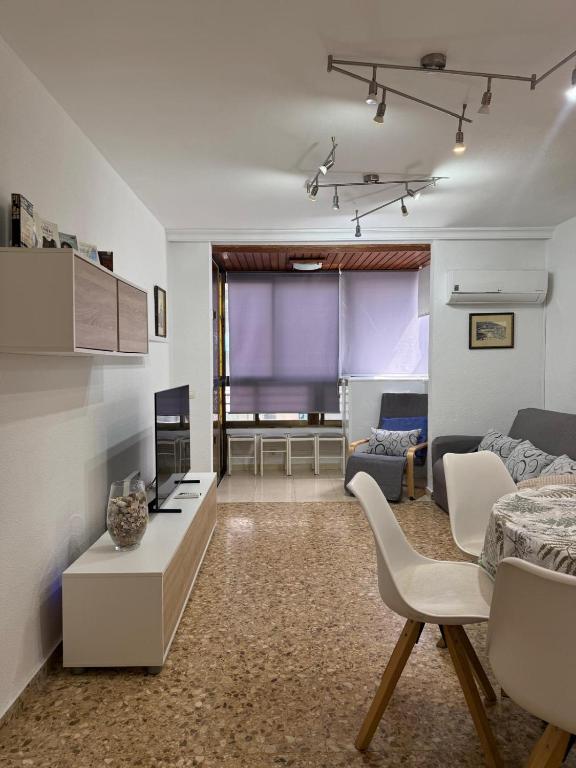 a living room with a couch and a table at La Explanada in Alicante
