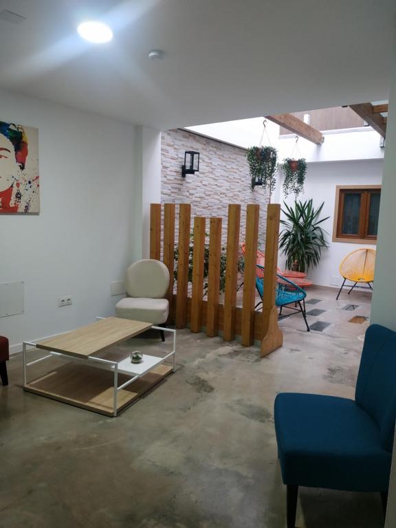 a living room with a couch and a table at Alojamiento Gofioplaya in Arinaga
