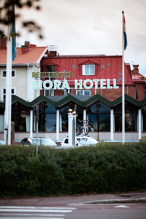 a motor hotel with a car parked in front of it at Mora Hotell & Spa in Mora
