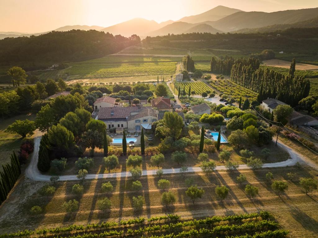 an aerial view of a villa in a vineyard at Clos Saint-Michel Resort & Spa in Malaucène