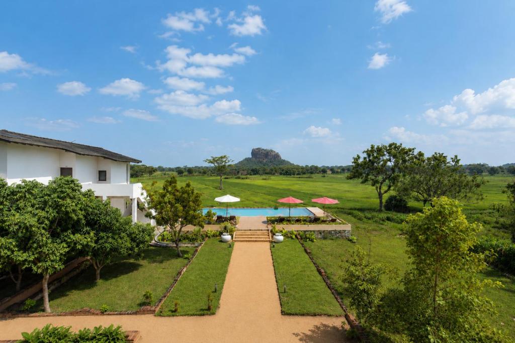 an aerial view of a resort with a pool at Ceylon Breeze Sigiriya in Sigiriya