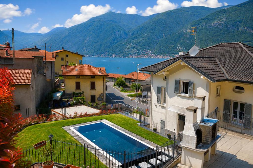 an aerial view of a house with a swimming pool at Lescen White Residence - swimming pool in Lezzeno