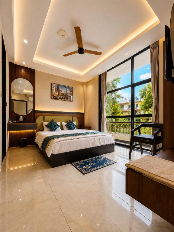 a bedroom with a bed and a large window at Hotel Shakuntla Palace - 400 Meters away from Vishnu Pad Temple 7 mins walk in Gaya