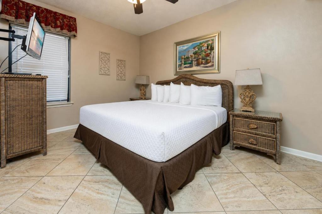 a bedroom with a large bed and a nightstand at Phoenix X 908 in Orange Beach