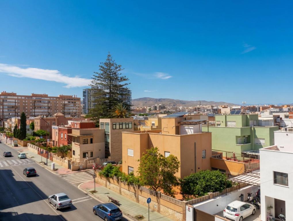 a view of a city with cars parked on a street at COSTA DE ALMERIA PLAYA in Almería