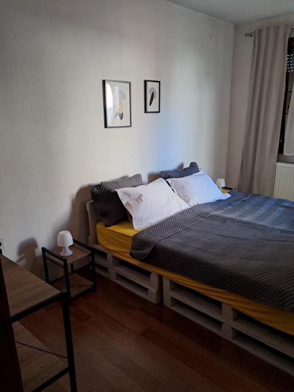 a bedroom with a bed in a room at TILIA Apartmet in Struga