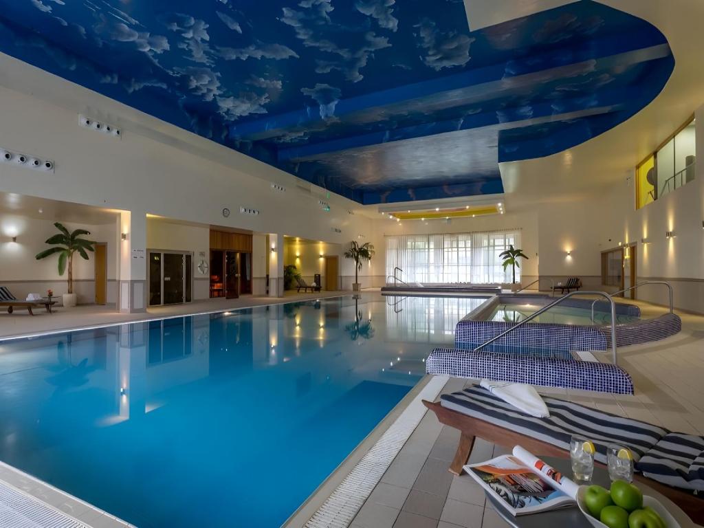 a large swimming pool with a blue ceiling at Mullingar Park Hotel in Mullingar