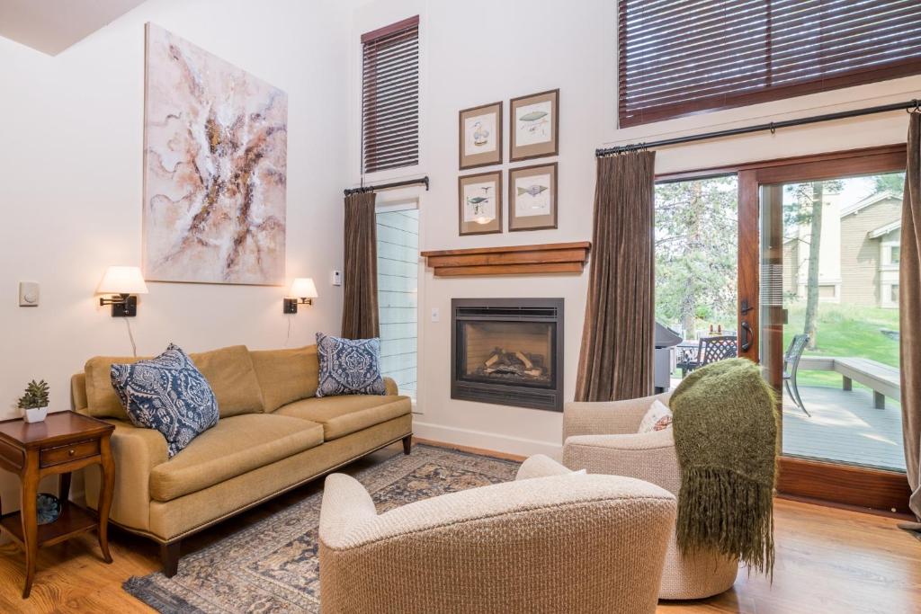 a living room with a couch and a fireplace at Indian Springs in Sun Valley
