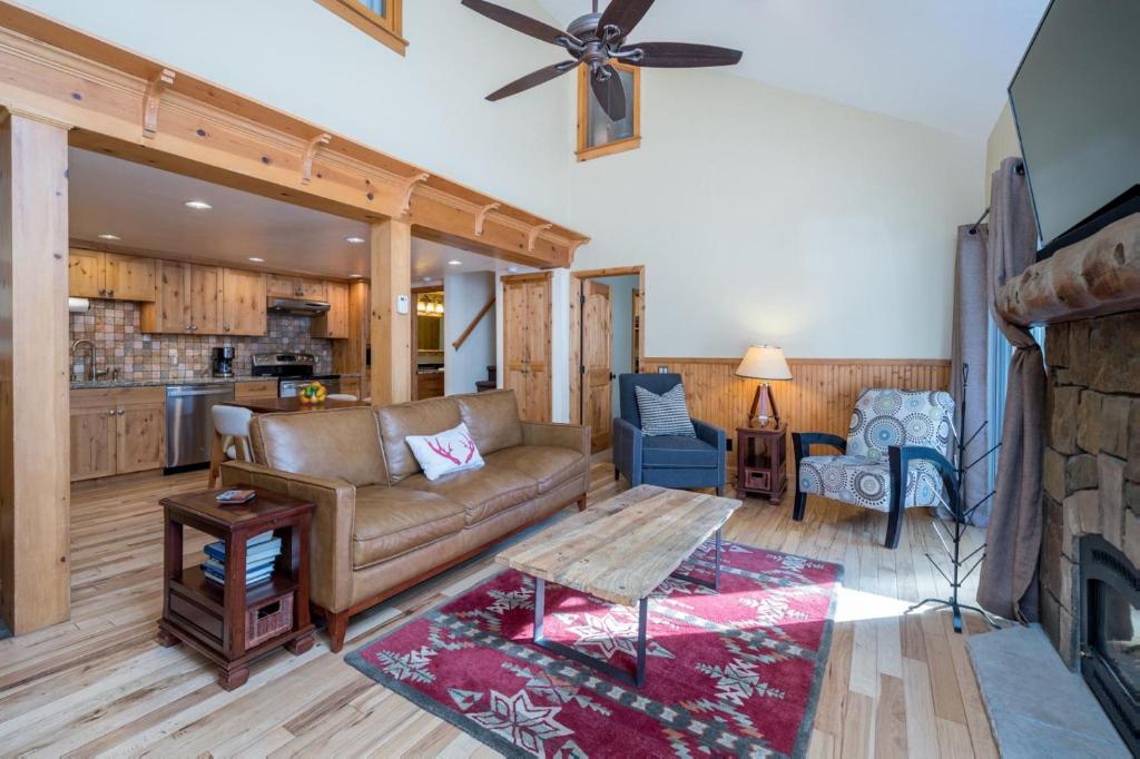 a living room with a couch and a fireplace at Krystal Villa #5 in Ketchum