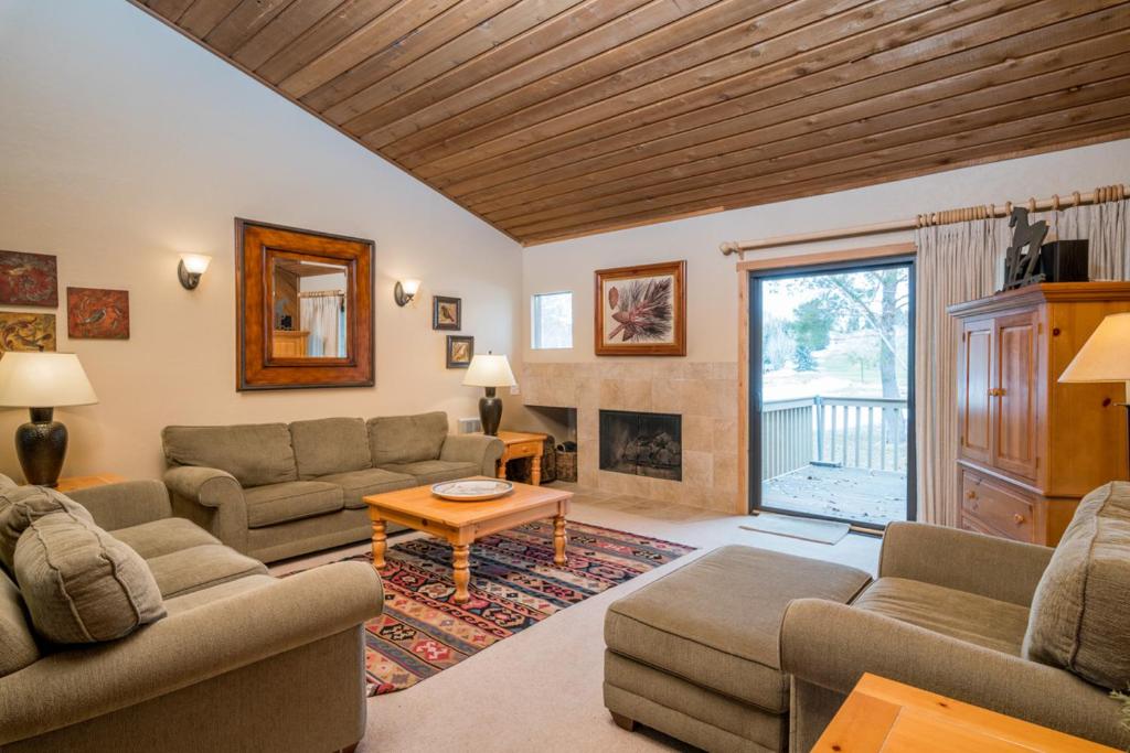 a living room with two couches and a fireplace at Ridge - 2682 at Elkhorn in Elkhorn Village