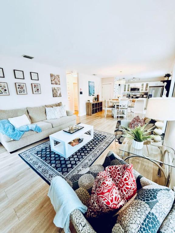 a living room with a couch and a table at Quiet retreat near Coconut Grove free parking in Miami