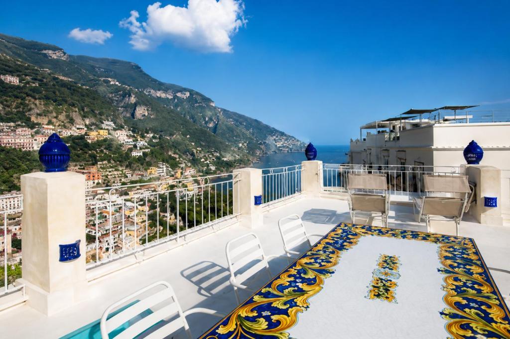a balcony with a view of the amalfi coast at Love in Blue - La Terrazza di Positano in Positano