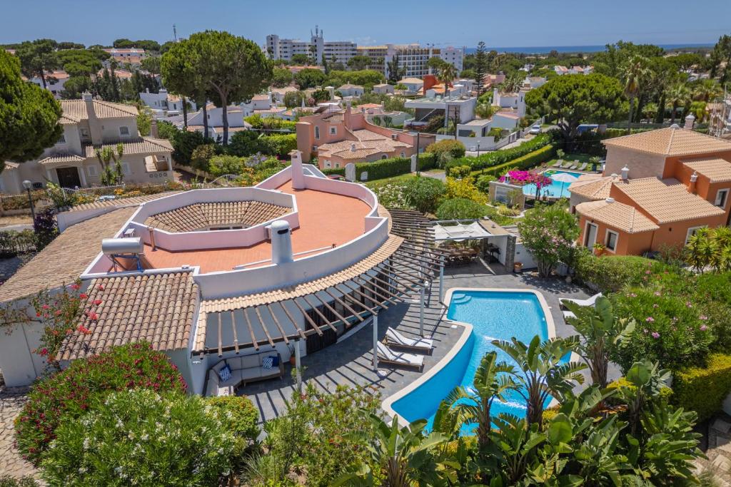 an aerial view of a house with a swimming pool at Vilamoura 4-Bedroom Private Pool Villa in Vilamoura