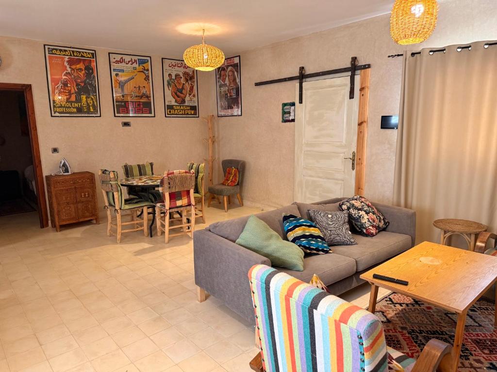 a living room with a couch and a table at Villa Tiziri in Essaouira