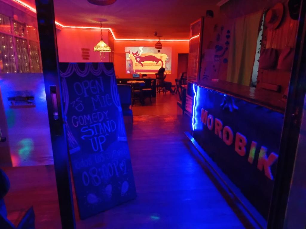 a room with a bowling alley with purple lights at Hostal Cultural Casa Morobik in Popayan