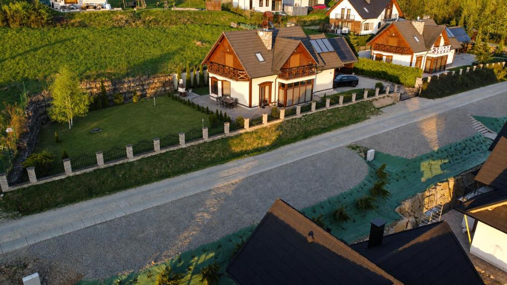 an overhead view of a house on a street at Dom Na Stoku - Hillside Cottage Eliza in Szczawnica