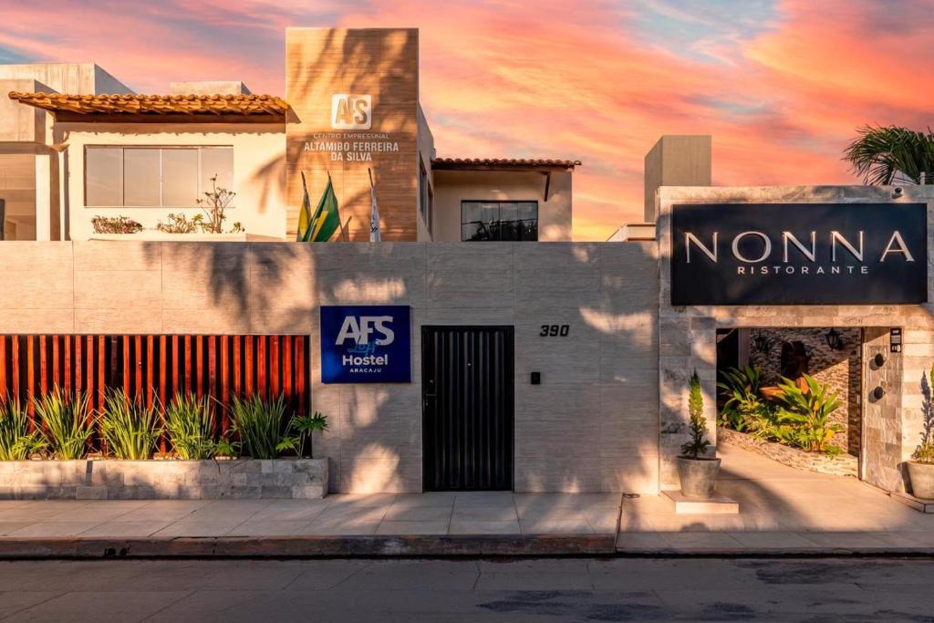 a building with a sign on the side of it at AFS LOFT HOSTEL Aracaju in Aracaju