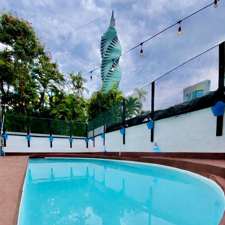 a view of a swimming pool with a building at Panama Experience Hostal in Panama City