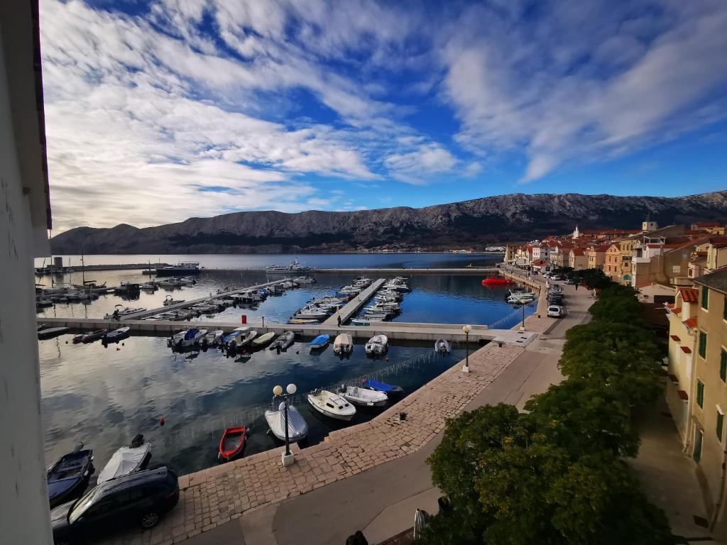 a view of a marina with boats in the water at Villa Veli Palac in Baška