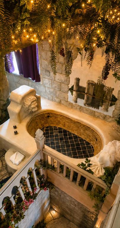 an overhead view of a building with a fountain and lights at Castle Wood Cottages in Big Bear Lake