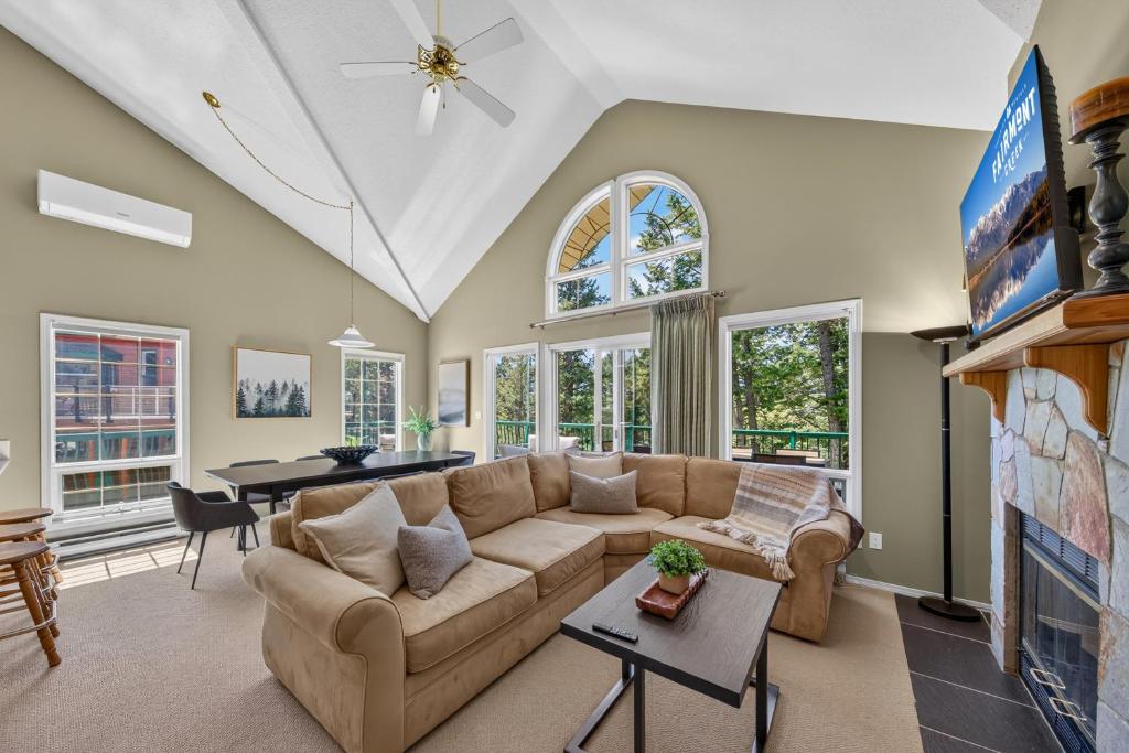 a living room with a couch and a table at Marble Canyon in Fairmont Hot Springs