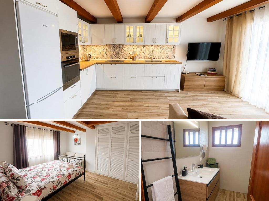 a kitchen with white cabinets and a bed in a room at casa moni 2 in El Paso