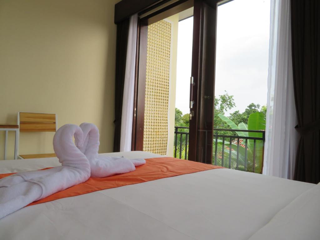 Letto o letti in una camera di Odah Ayu Guest House