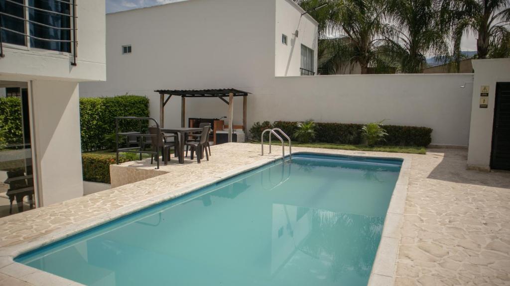 a swimming pool in the middle of a house at Villas del Guali - Piscina Privada in Santa Fe de Antioquia