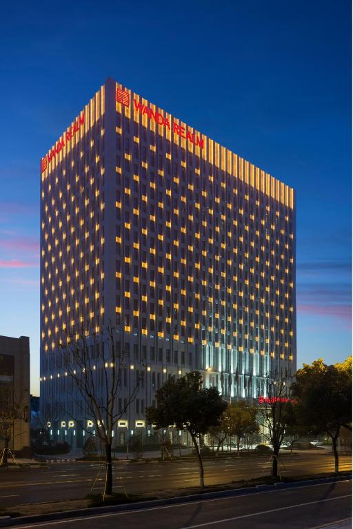 a large building with lights on the side of it at Wanda Realm Nanjing in Jiangning