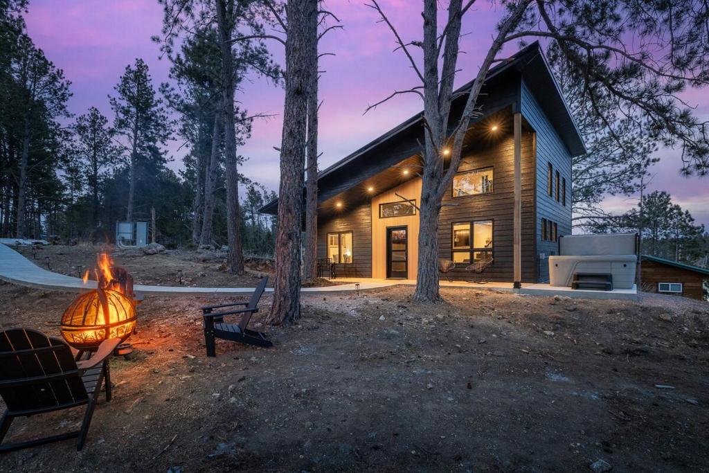 a house with a lamp in front of it at Hottub Haven BHBungalows #9 in Custer