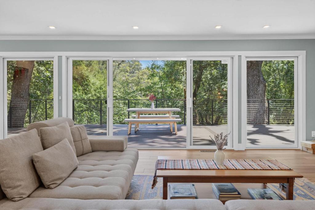 a living room with a couch and a table at The Enso Sonoma in Glen Ellen