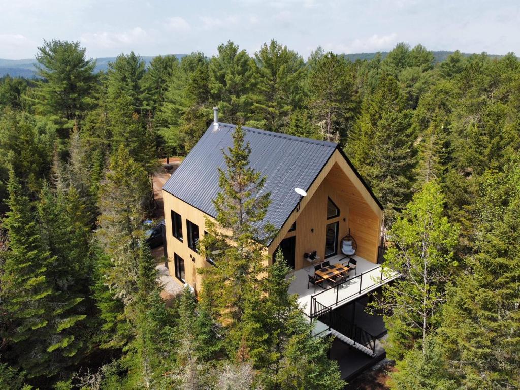 an aerial view of a house in the woods at Chalet OSLO in Saint Come