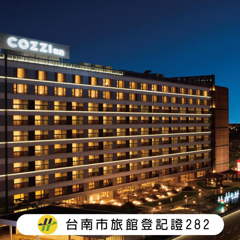 a building with a sign on top of it at Hotel COZZI Ximen Tainan in Tainan
