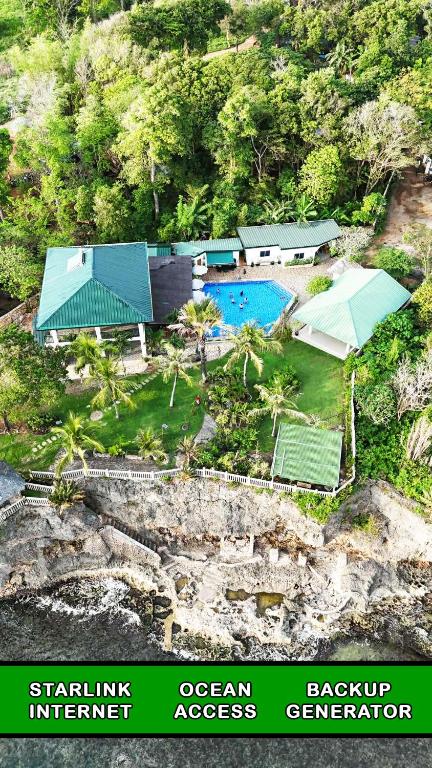 an aerial view of a resort with a swimming pool at Casa Feliz Ocean Resort in Siquijor