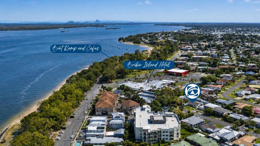 an aerial view of a city and the water at Bella Cove in Bellara