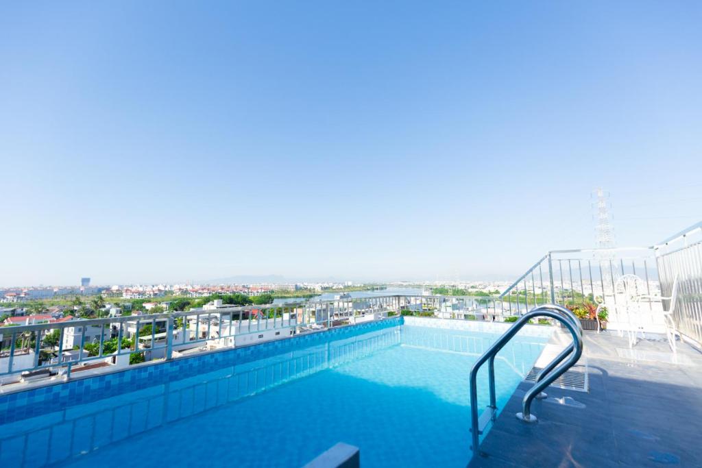 a swimming pool on the top of a building at The BHA Riverside in Danang