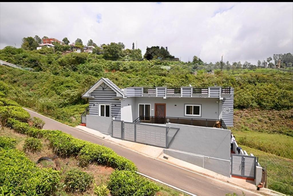 a house on the side of a road at Revival Villa in Coonoor
