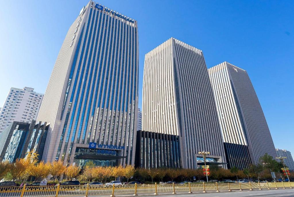 a group of tall buildings in a city at Wyndham Handan Congtai in Handan