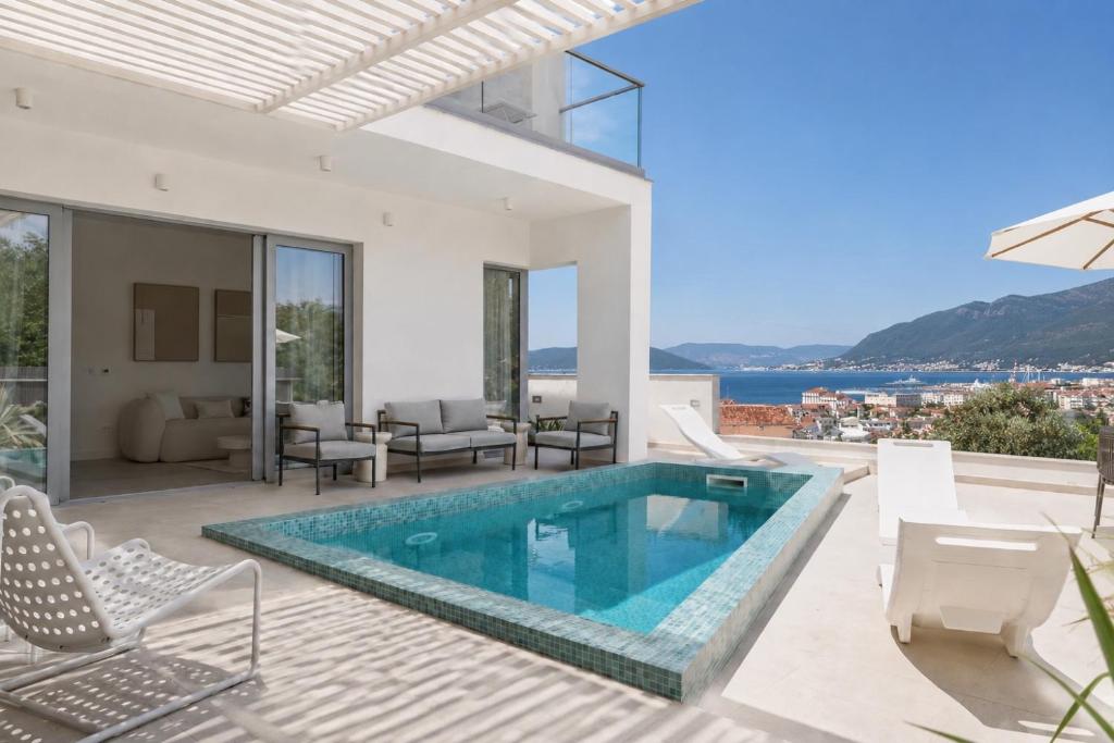 a swimming pool in a villa with a view at White Pearl Villa in Tivat