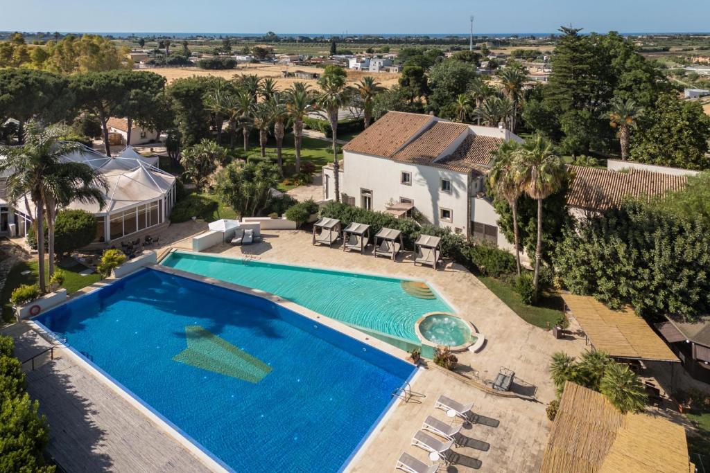 an aerial view of a swimming pool at a house at Dimora Caiammari Luxury Hotel & Spa in Syracuse