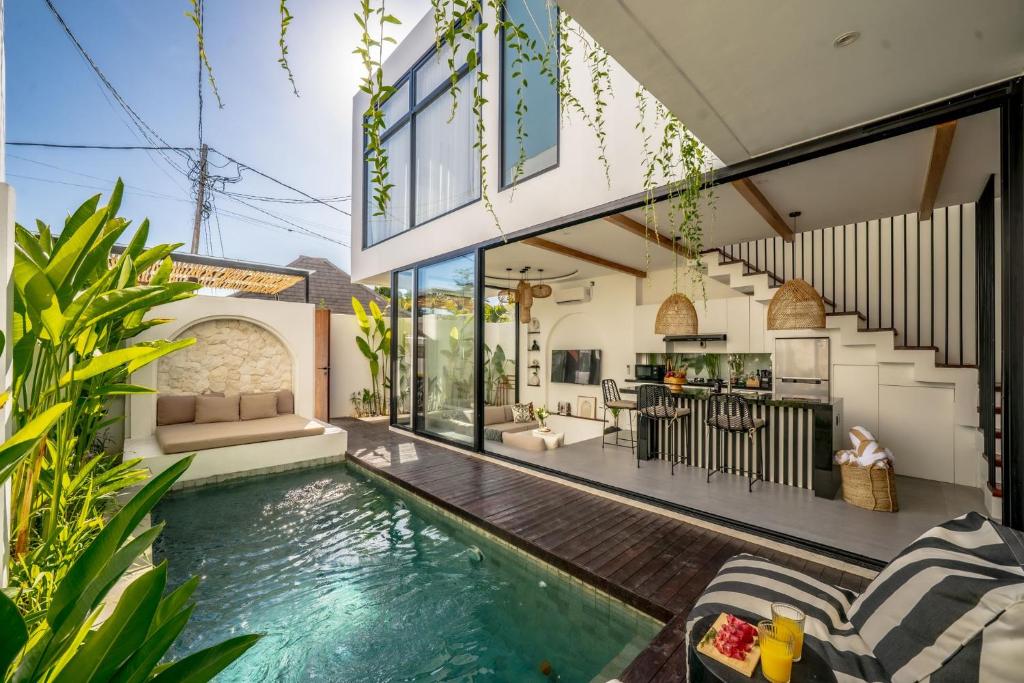 an indoor swimming pool in the middle of a house at Villa Scorpia 1 Bingin in Bingin Beach