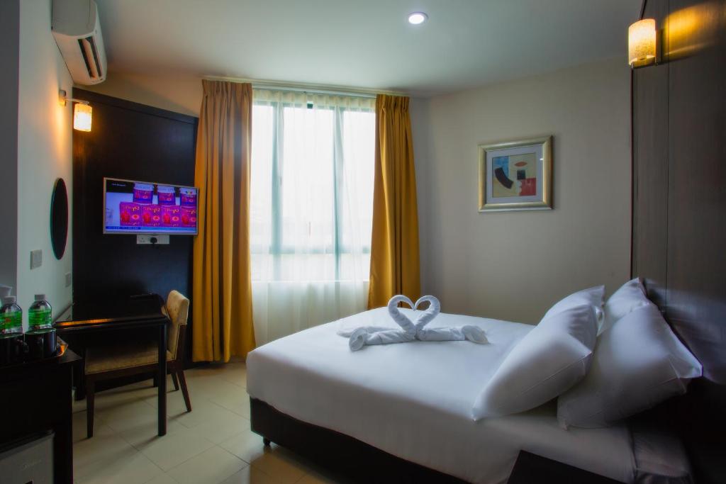 Katil atau katil-katil dalam bilik di Akar Hotel Jalan TAR