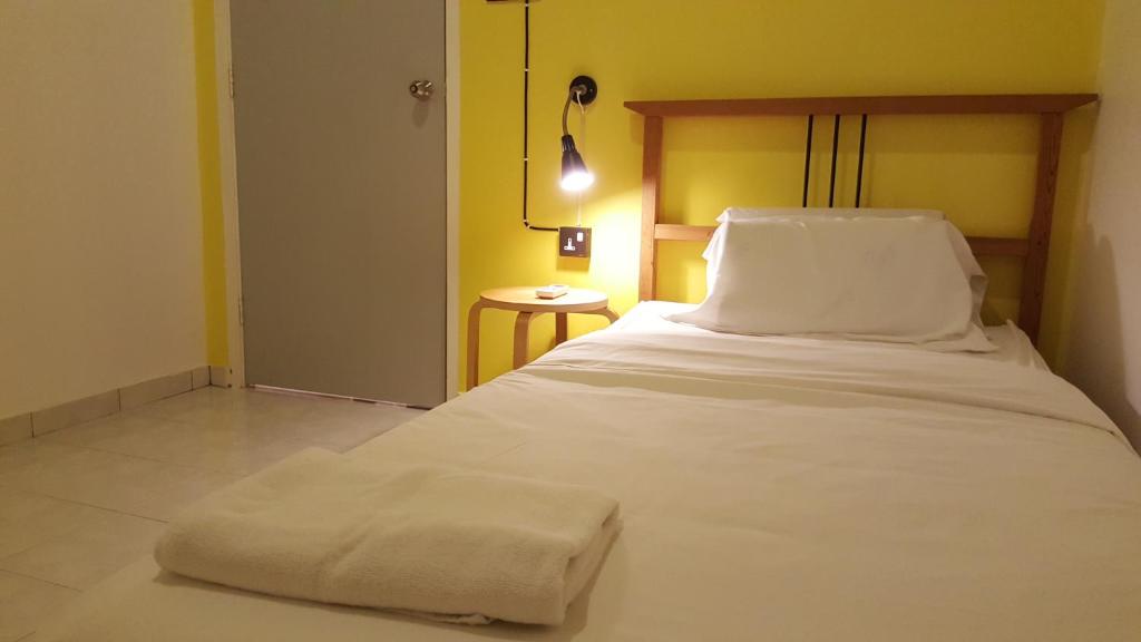 Postel nebo postele na pokoji v ubytování Tulip Hotel