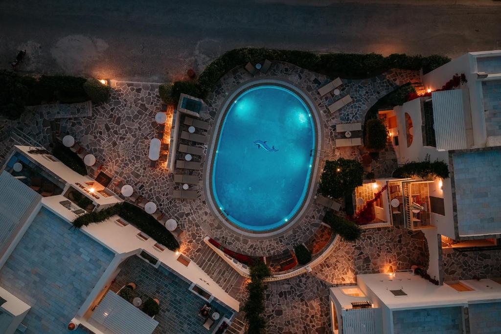 an overhead view of a swimming pool at night at Proteas Hotel & Suites in Agios Prokopios