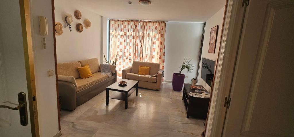 a living room with a couch and a table at Piso Tamaragua in Arrecife