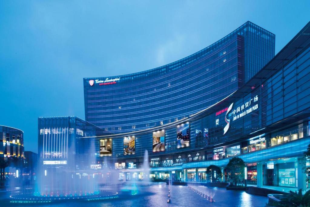 a large building in a city at night at Tonino Lamborghini Hotel Kunshan City Center in Kunshan