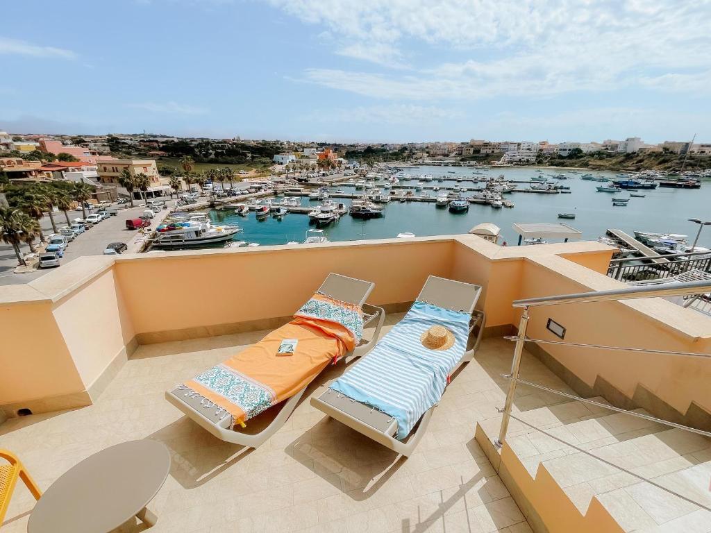 a balcony with a view of a marina at Best Western Hotel Martello in Lampedusa